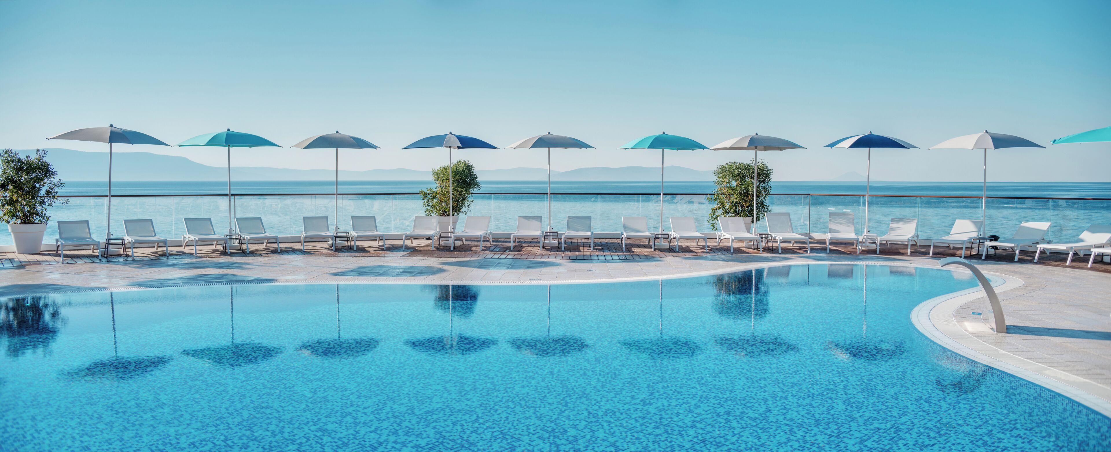 Seasonal outdoor pool, pool umbrellas, pool loungers