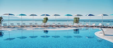 Seasonal outdoor pool, pool umbrellas, pool loungers