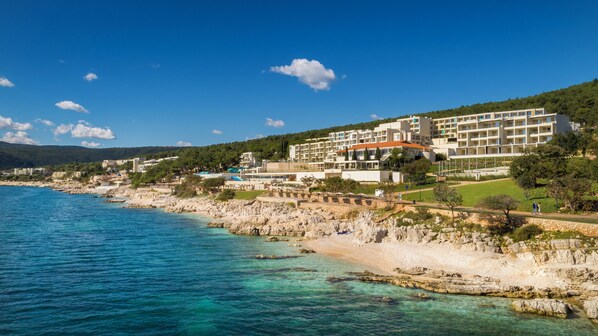 On the beach, sun-loungers, beach umbrellas, scuba diving