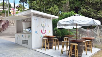 5 bars/lounges, poolside bar, beach bar