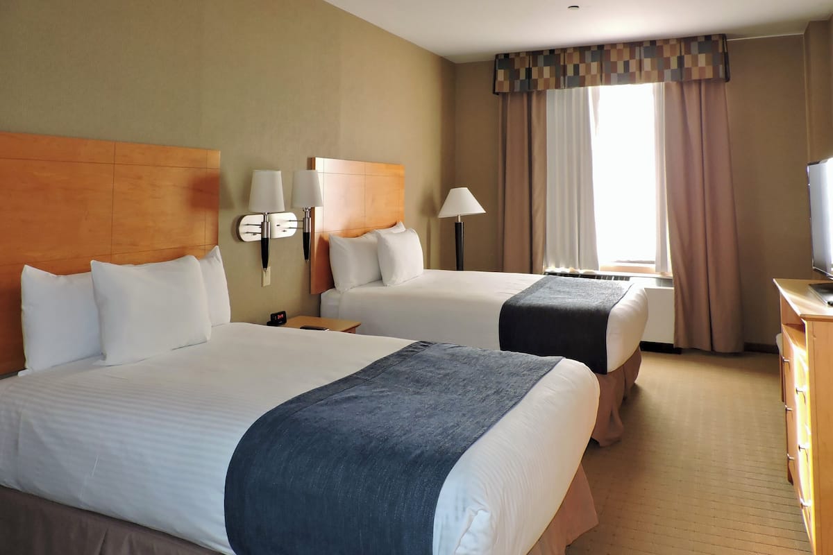 classic double room, 2 double beds | premium bedding, down duvets, pillow-top beds, in-room safe