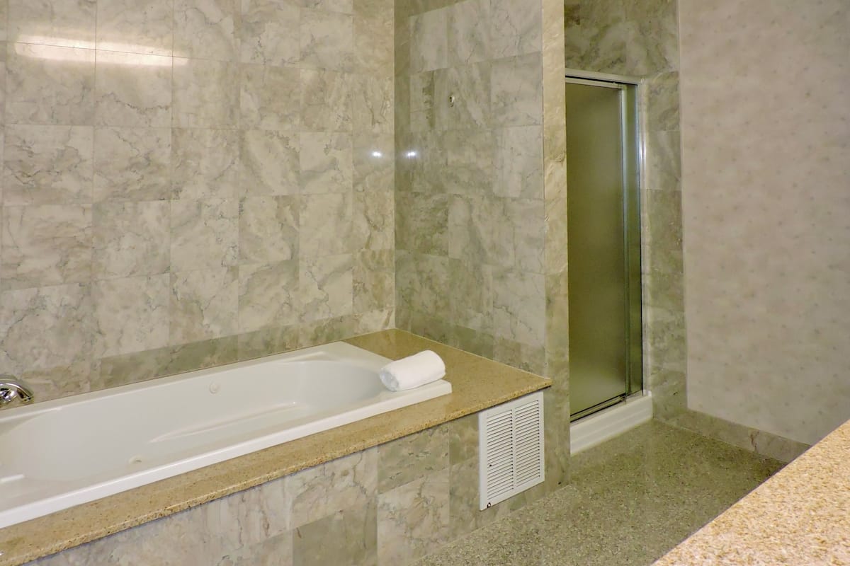 family suite, 2 bedrooms | bathroom | combined shower/bathtub, free toiletries, hair dryer, towels