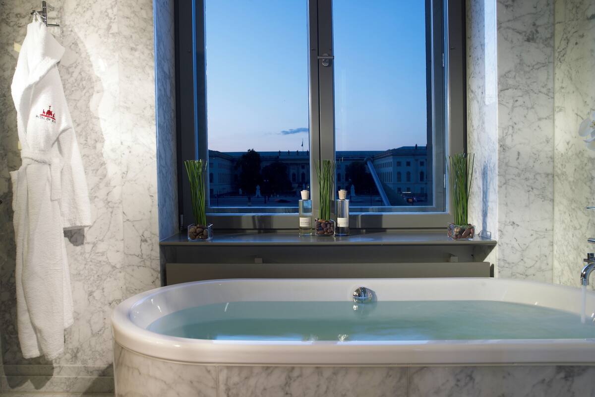 suite (humboldt) | bathroom | separate bathtub and shower, rainfall showerhead, designer toiletries