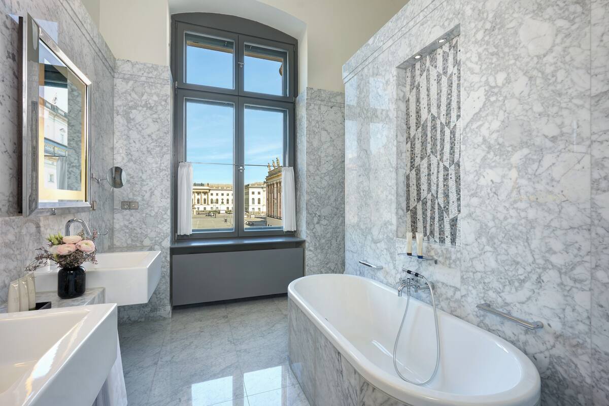 separate bathtub and shower, rainfall showerhead, designer toiletries