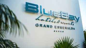 A hotel sign with the name "BlueBay Hotels & Resorts" and "Grand Esmeralda" written on it.