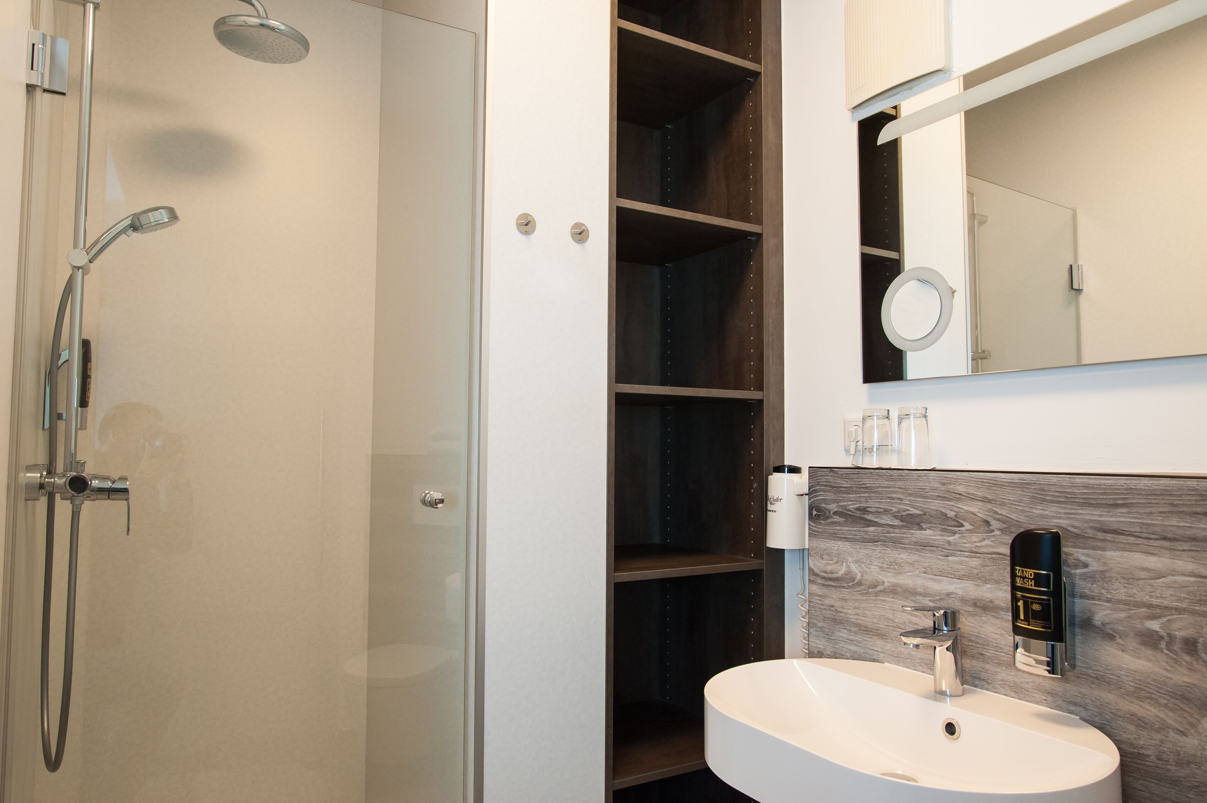 economy room (street view) | bathroom | hair dryer, towels, soap, shampoo