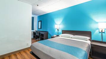 Desk, laptop workspace, blackout drapes, iron/ironing board