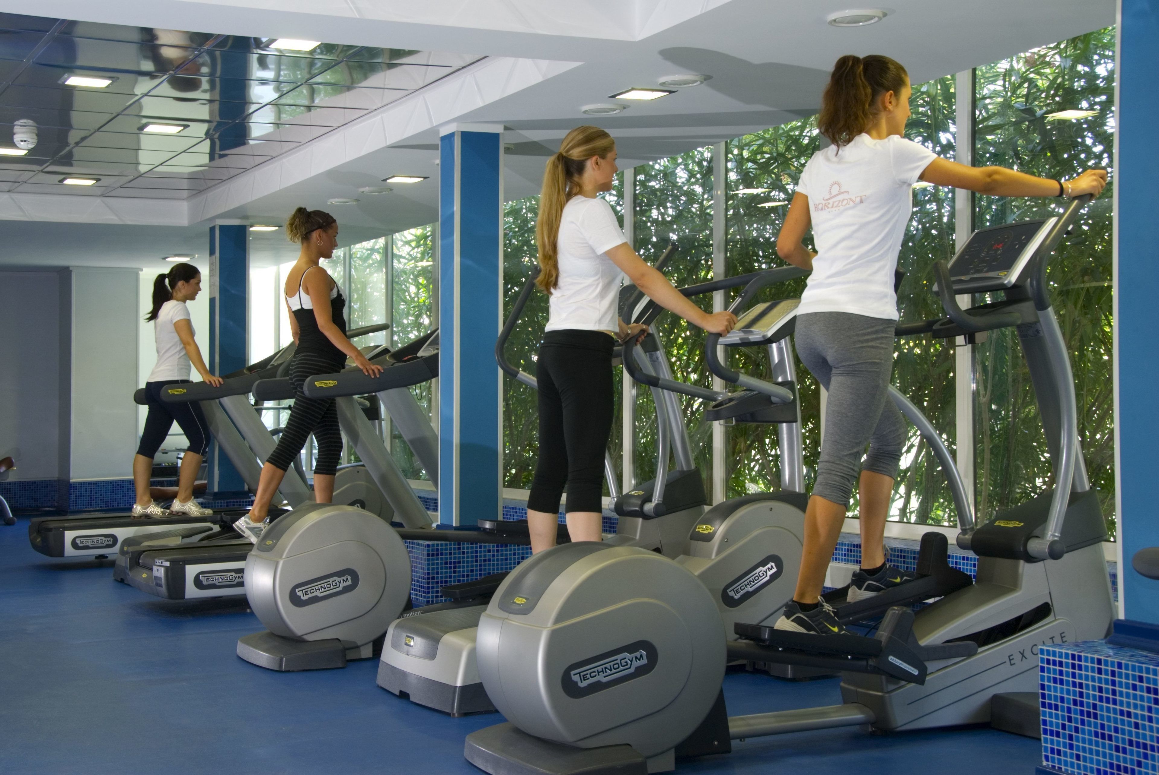A gym with treadmills and exercise equipment.