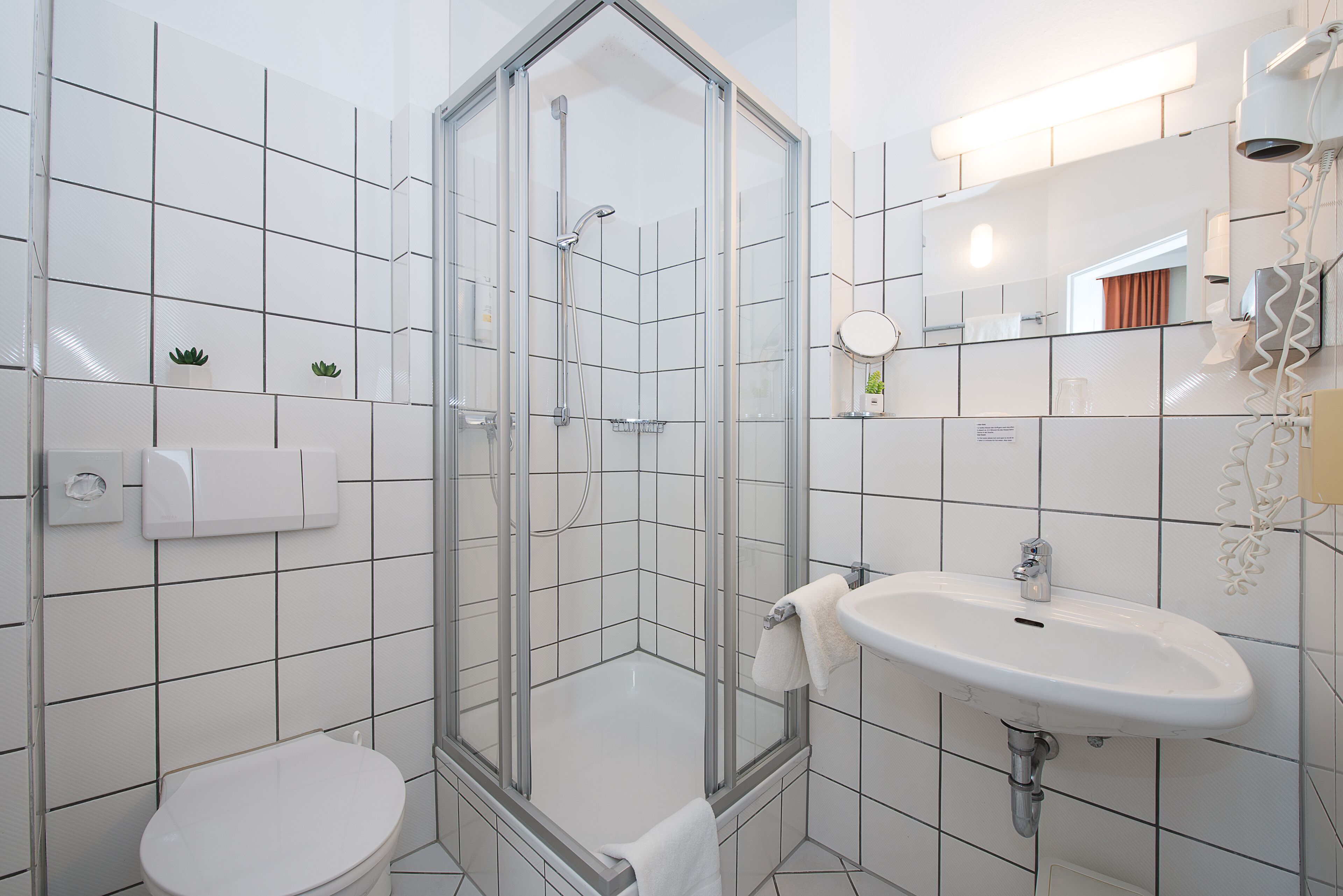 shower, eco-friendly toiletries, hair dryer, slippers