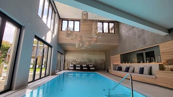 Indoor pool, open 7:00 AM to 8:30 PM, pool loungers