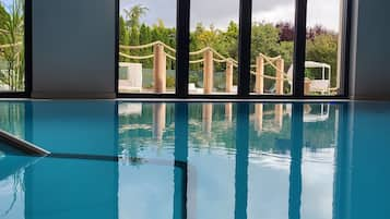 Indoor pool, open 7:00 AM to 8:30 PM, pool loungers