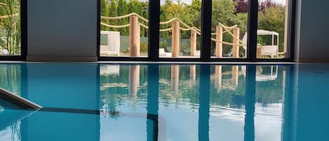 Indoor pool, open 7:00 AM to 8:30 PM, pool loungers