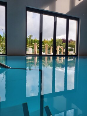 Indoor pool, open 7:00 AM to 8:30 PM, pool loungers