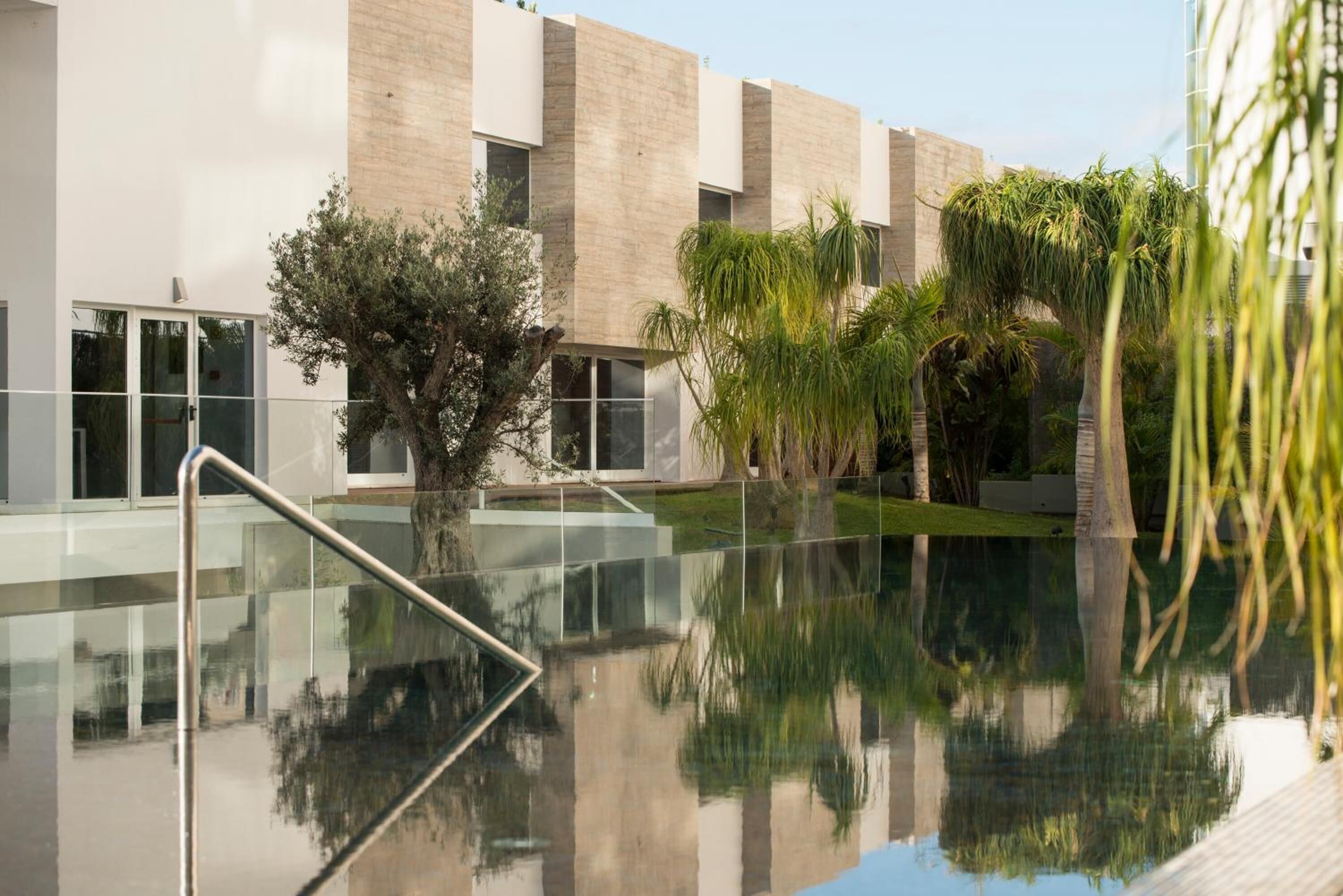 outdoor pool, pool umbrellas, pool loungers