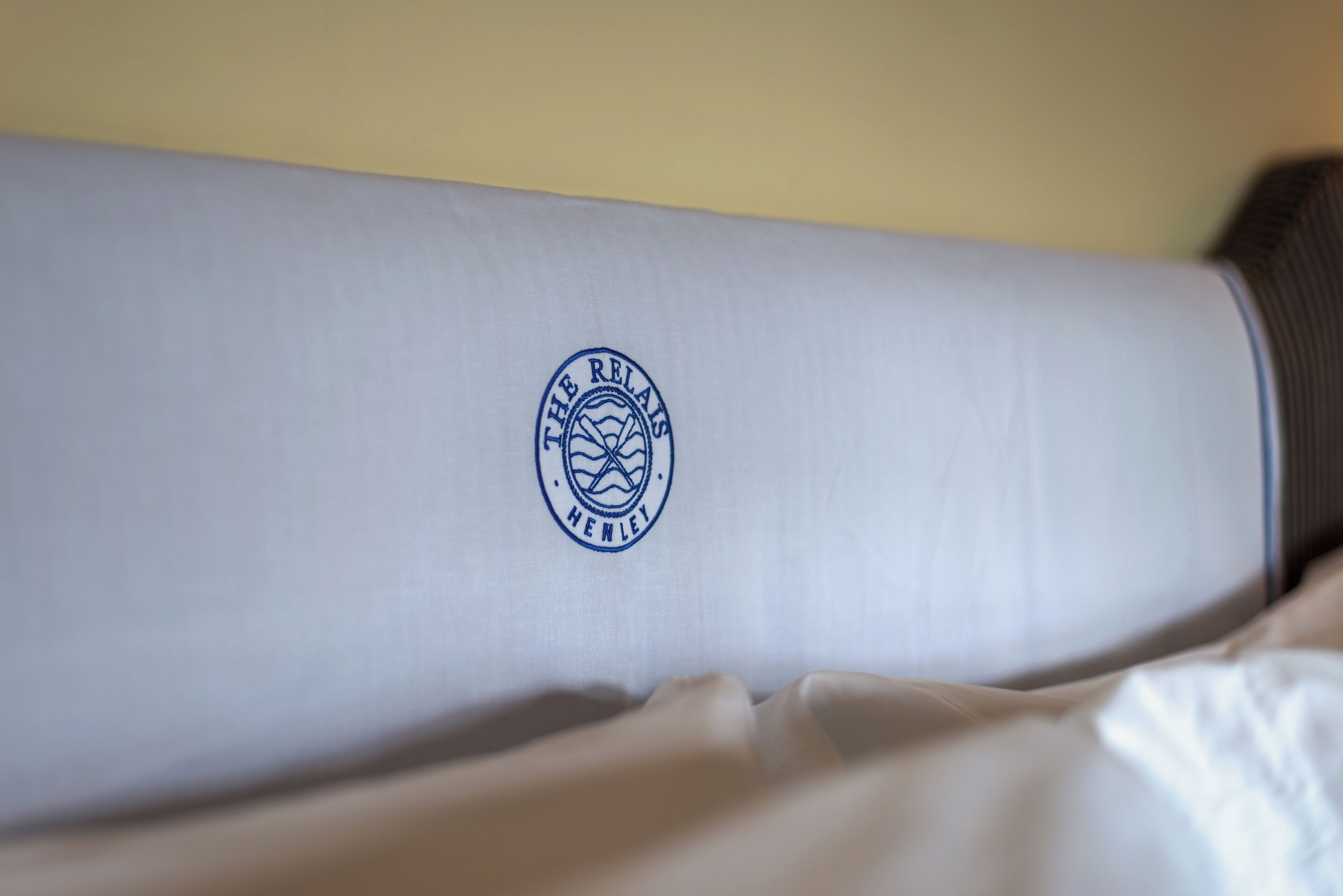 A pillow with a logo on it.