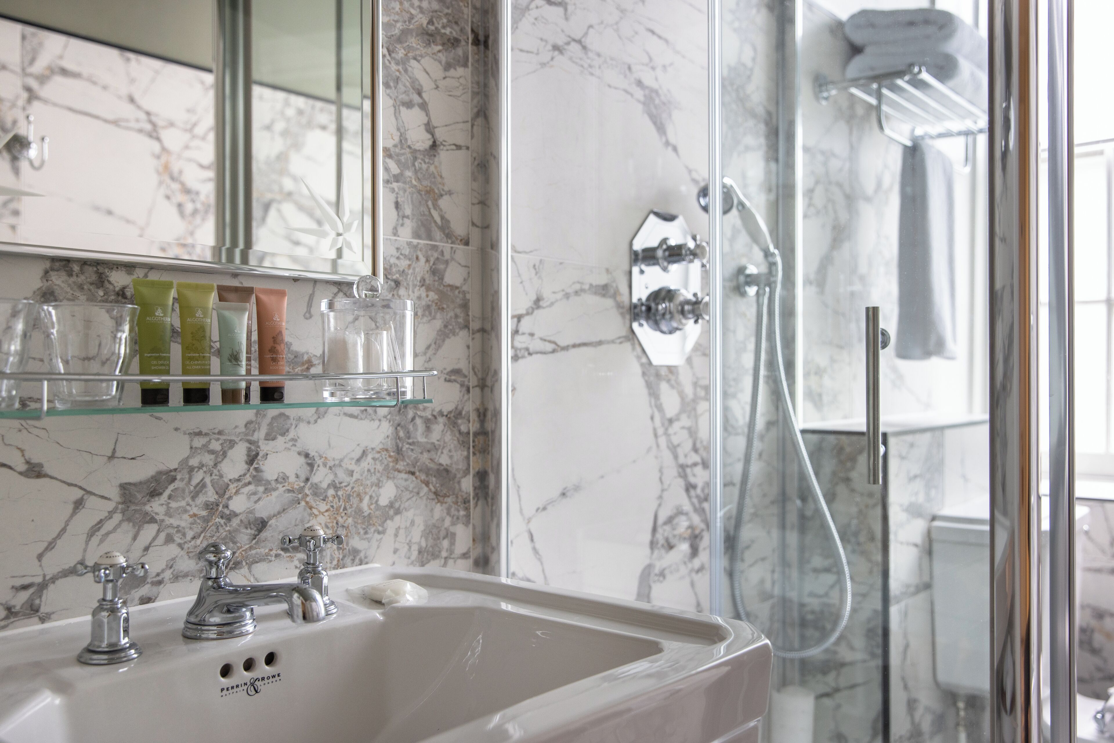 family room | bathroom | shower, designer toiletries, hair dryer, bathrobes