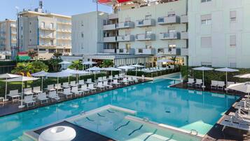 Seasonal outdoor pool, open 9:00 AM to 6:00 PM, pool umbrellas