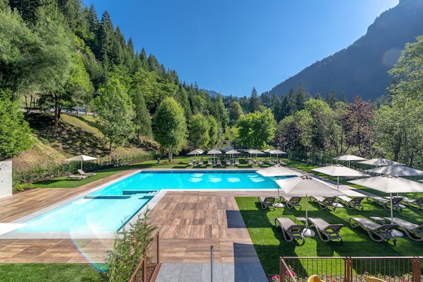 Seasonal outdoor pool, pool umbrellas, pool loungers