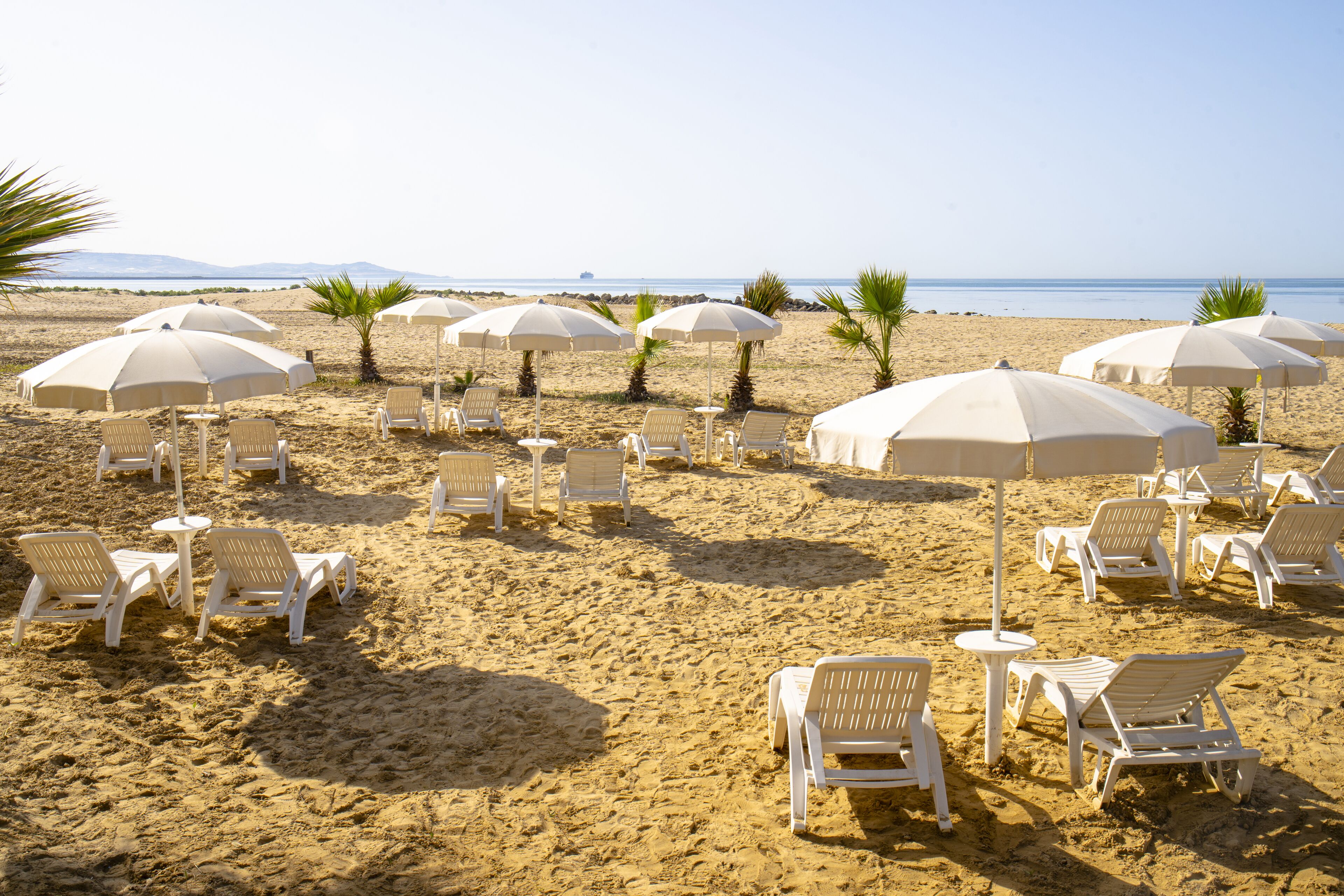 On the beach, sun loungers, beach umbrellas, snorkeling