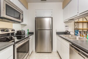 Standard Condo, 2 Bedrooms | Private kitchen | Fridge, microwave, stovetop, coffee/tea maker