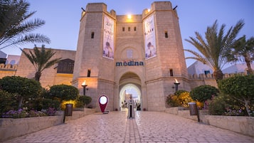 A historic building with a central archway and the name 'medina' on the facade.