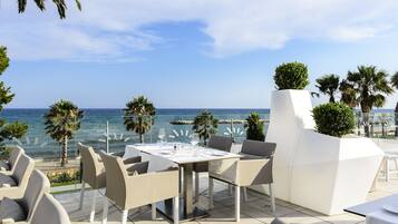 Enjoy a romantic meal for two on the patio with a breathtaking sea view.