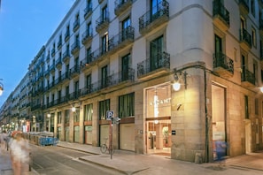 A multi-story building with a storefront labeled 'ANDANTE.'
