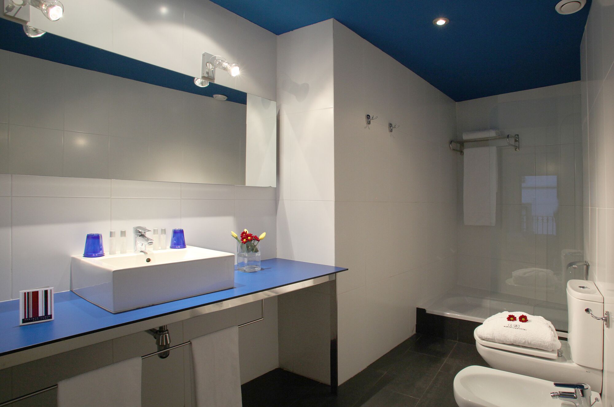 separate bathtub and shower, rainfall showerhead, hair dryer, towels