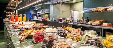 A buffet with various food items and condiments.