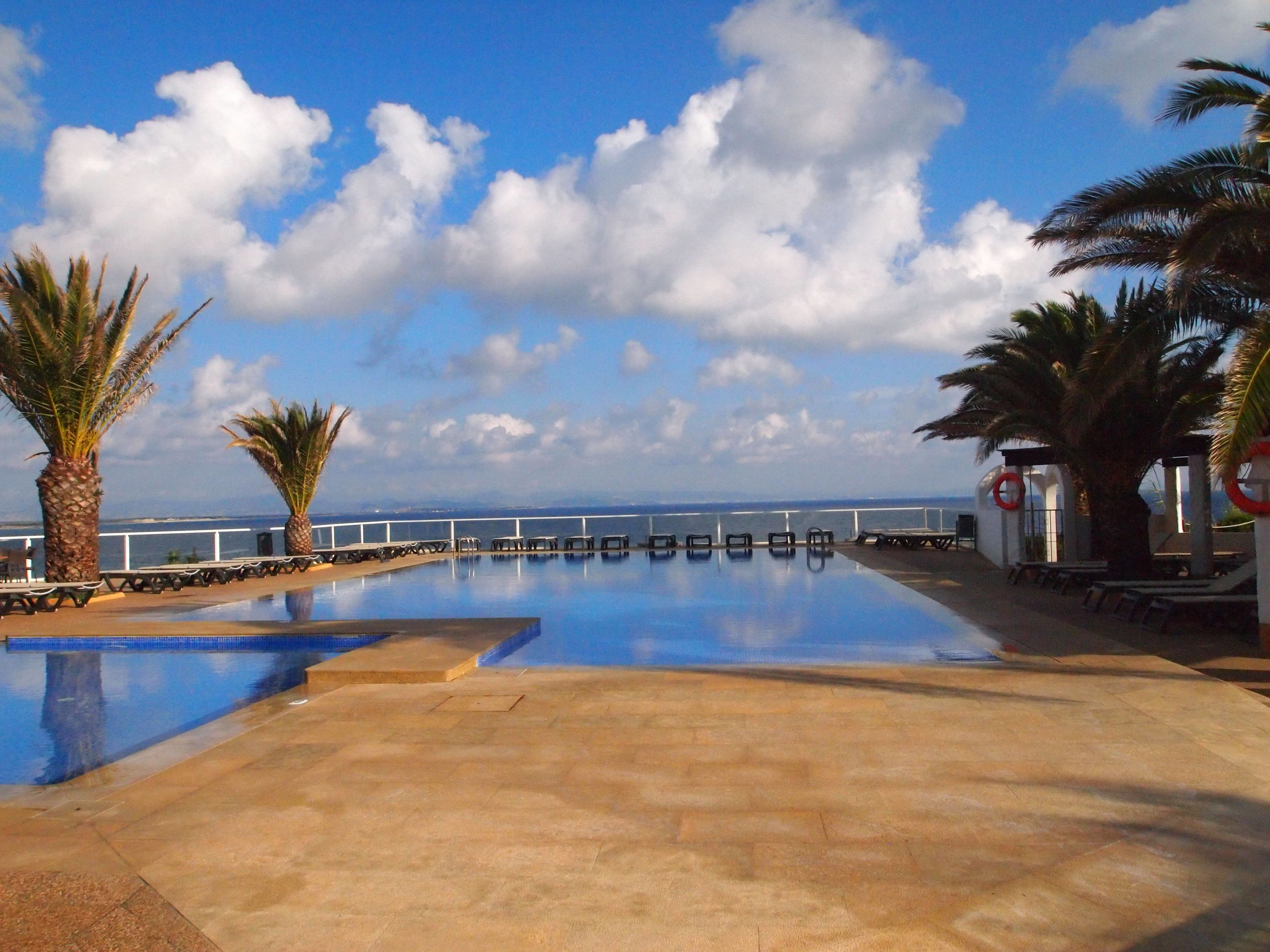 seasonal outdoor pool, open 11:00 am to 7:00 pm, pool umbrellas