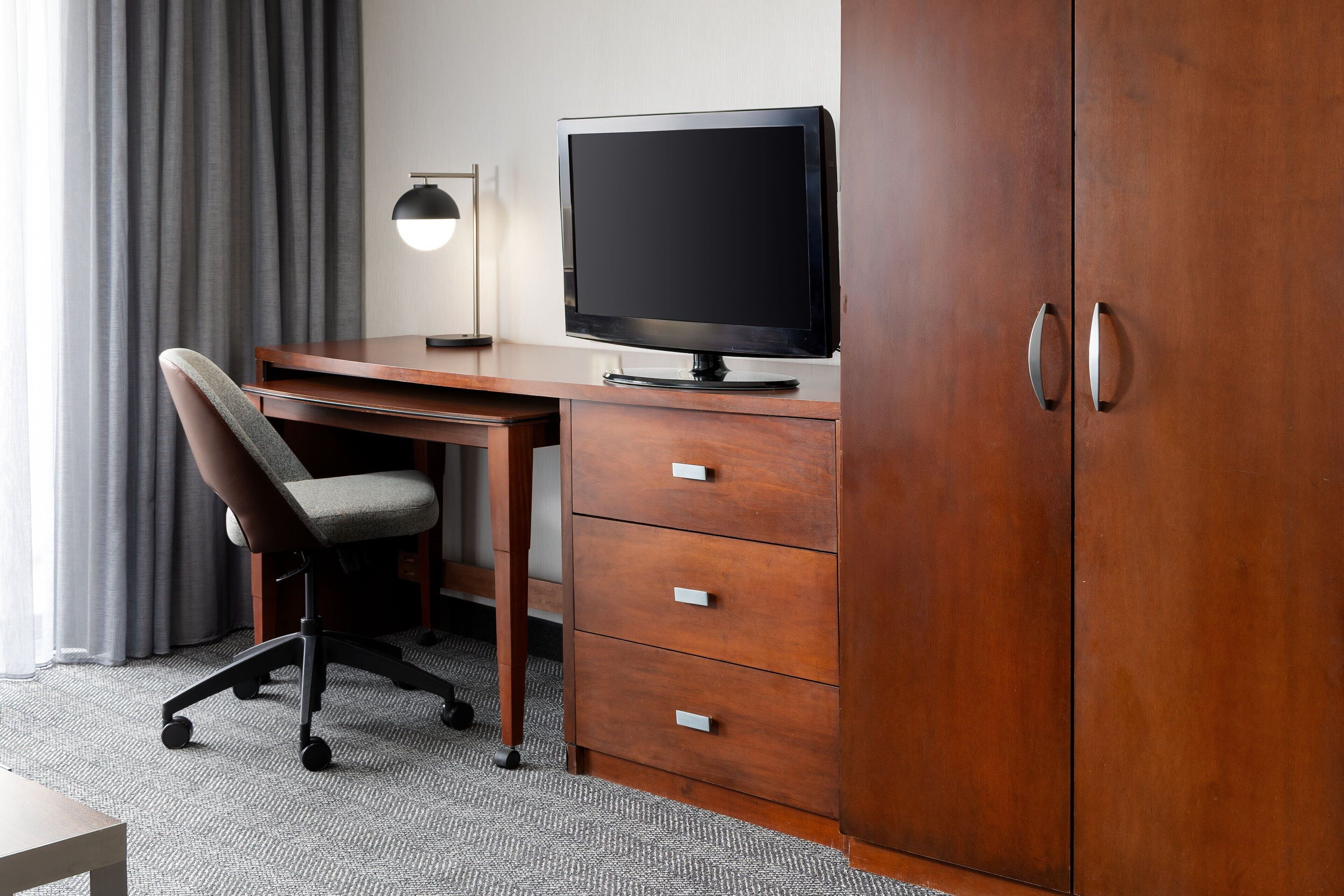 premium bedding, desk, blackout curtains, iron/ironing board