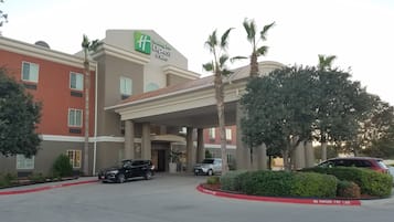 Welcome to Holiday Inn Express & Suites, featuring a modern design and beautifully landscaped surroundings.