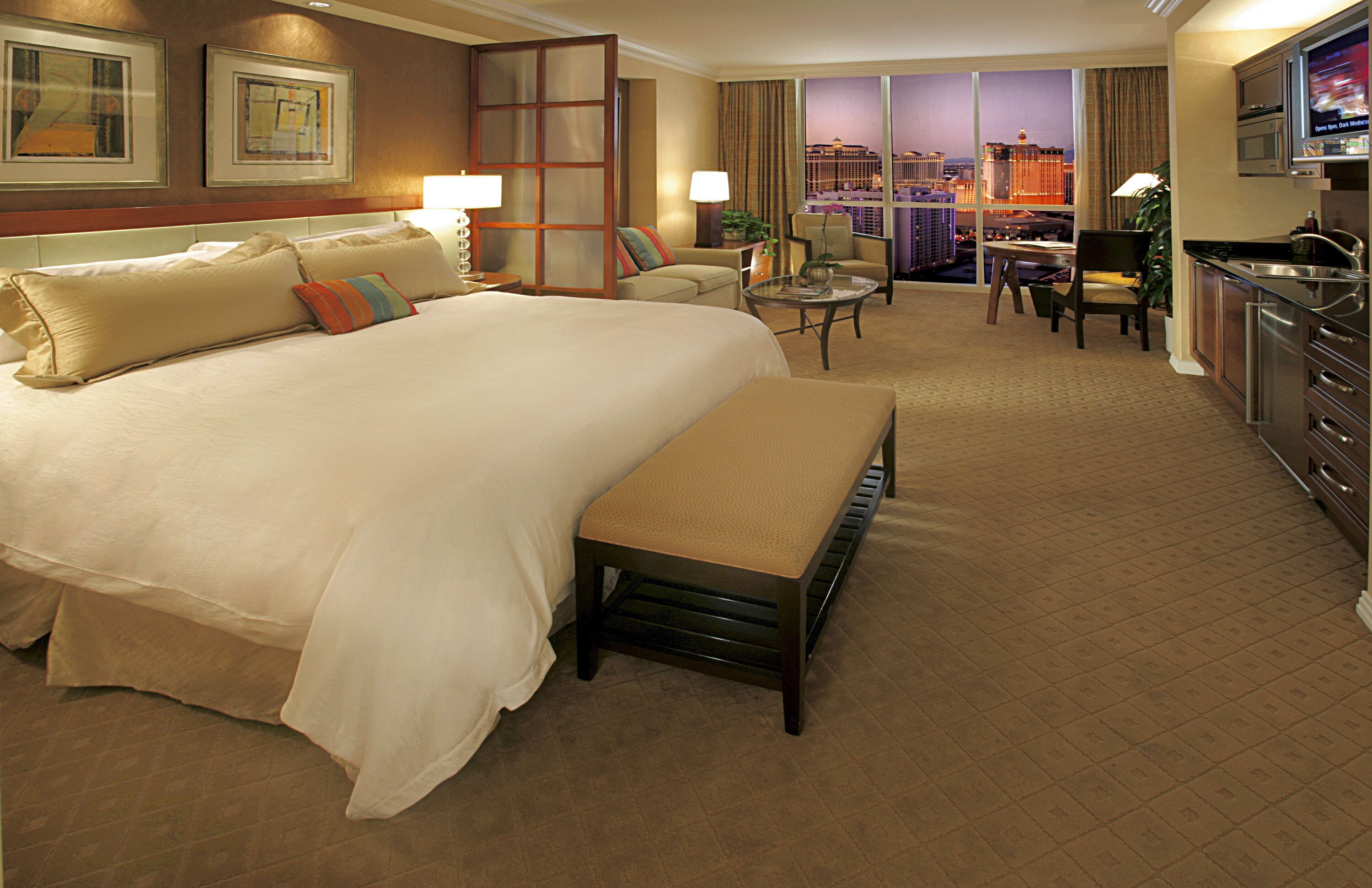 deluxe suite | premium bedding, pillow-top beds, in-room safe, desk