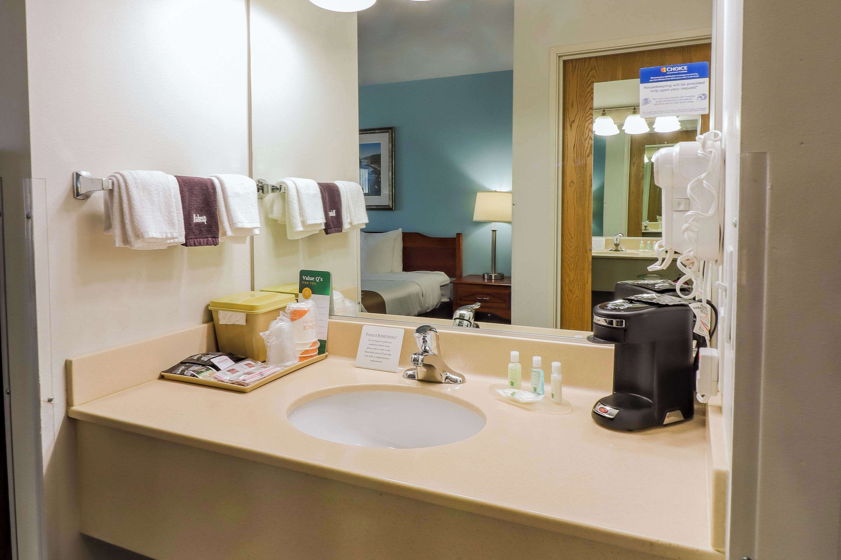 premium bedding, desk, blackout curtains, iron/ironing board