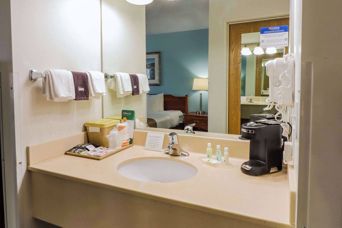 premium bedding, desk, blackout curtains, iron/ironing board