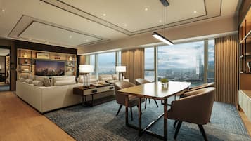 A modern hotel room with a living area, a dining table, and a large window offering a city view.