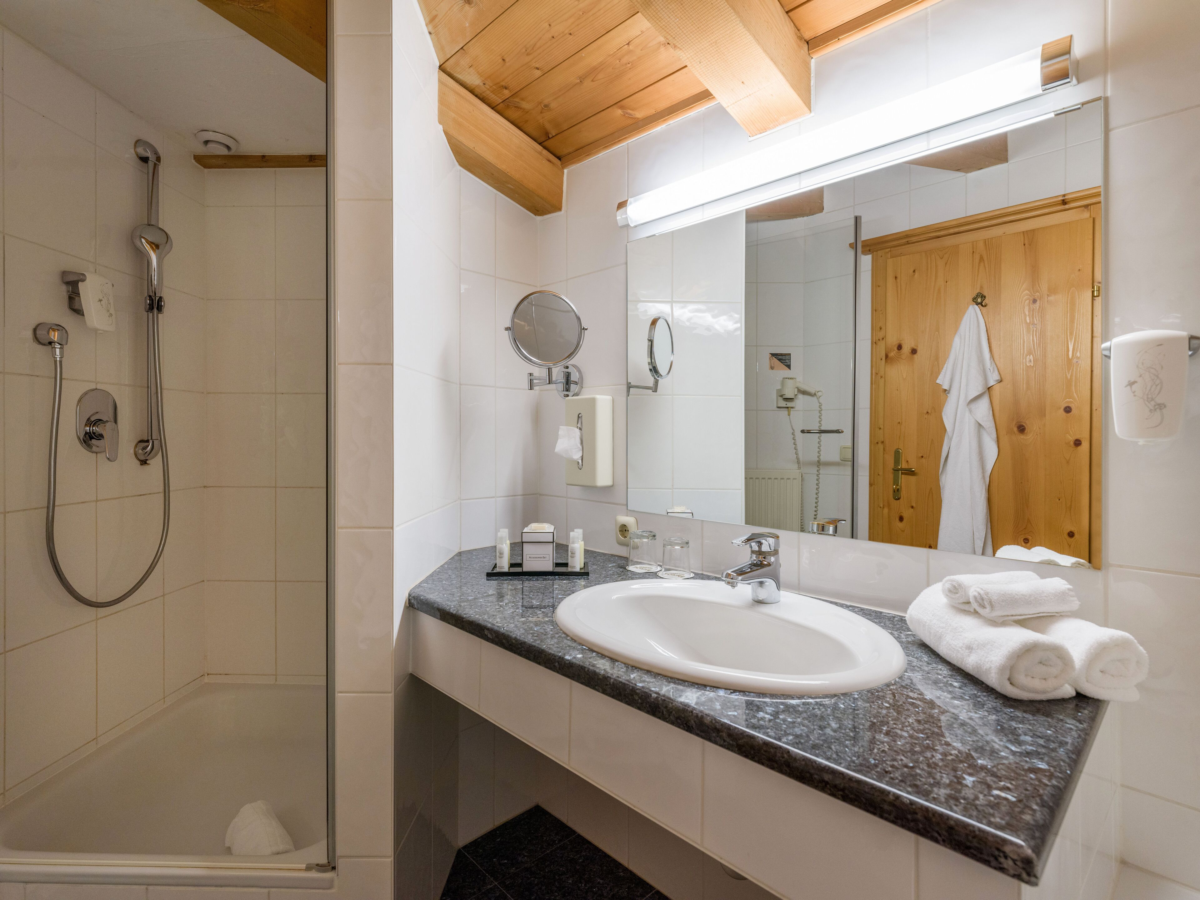 junior studio suite | bathroom | free toiletries, hair dryer, bathrobes, towels