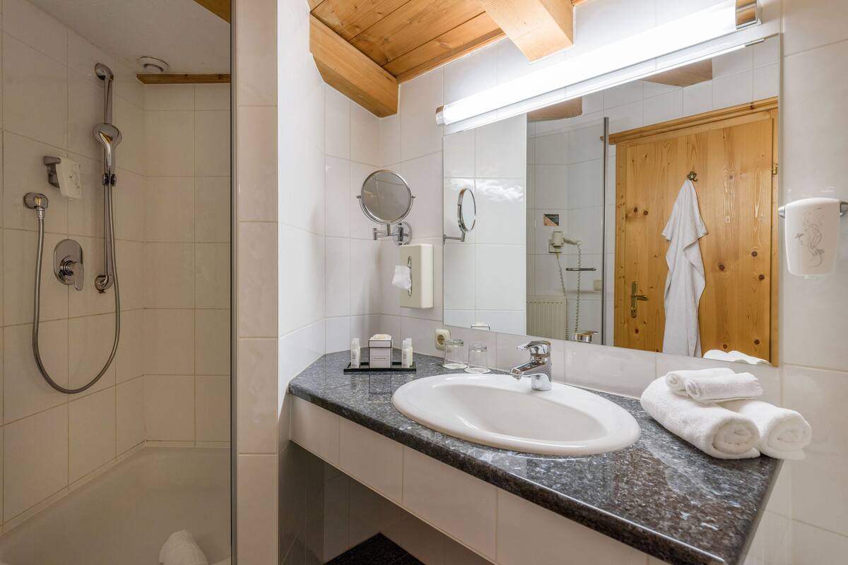 junior studio suite | bathroom | free toiletries, hair dryer, bathrobes, towels