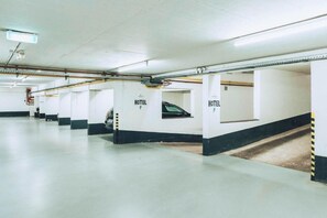 A hotel parking garage with multiple parking bays, each labeled with 'HOTEL P.' - Hotel Villa Klemm - Wiesbaden City (Wiesbaden)