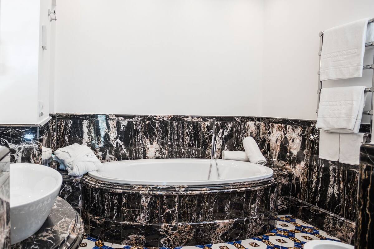 master suite | bathroom | shower, eco-friendly toiletries, hair dryer, bathrobes