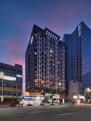 A high-rise hotel with multiple floors, large windows, and a prominent entrance. - Western Coop Residence Dongdaemun (Seoul)