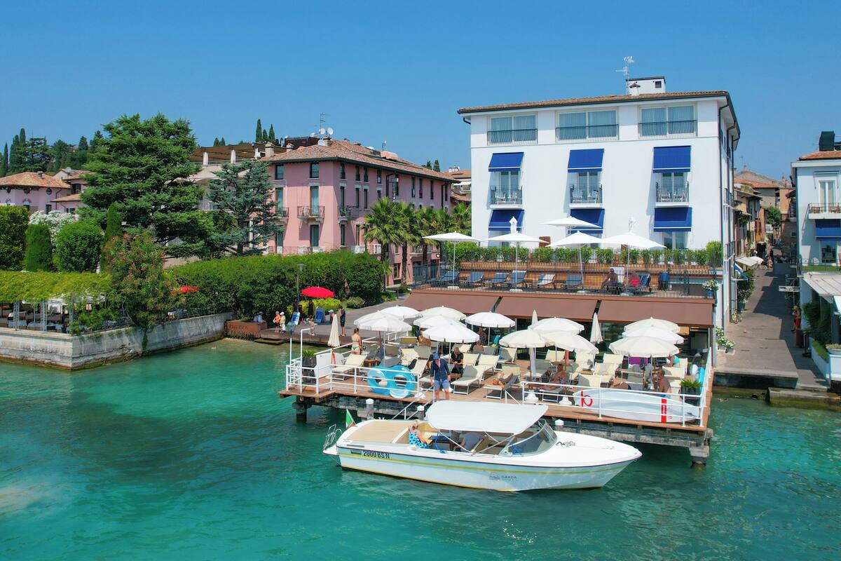 private beach, black sand, sun-loungers, beach umbrellas