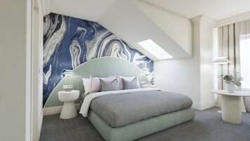 A modern bedroom with a curved headboard, a skylight, a round bedside table, and a small plant on a side table.
