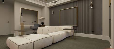 A modern living room with a sectional sofa, a small table, and a chair.