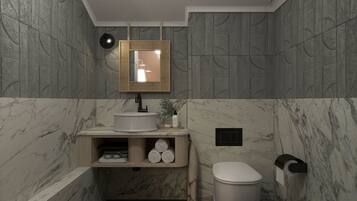 A modern bathroom with a marble wall, a sink, a toilet, and a mirror with a light.
