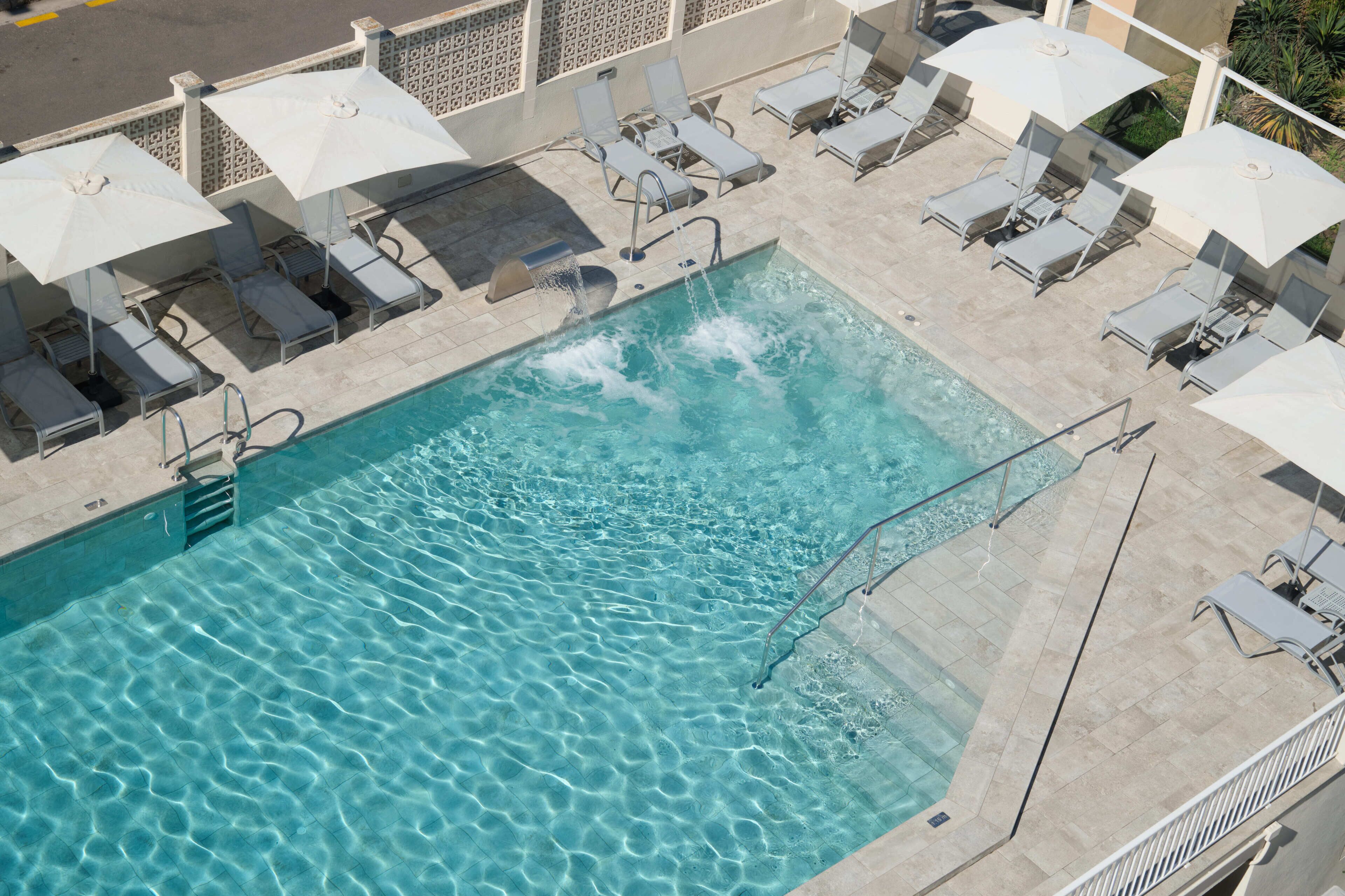 Indoor pool, outdoor pool, pool umbrellas, pool loungers