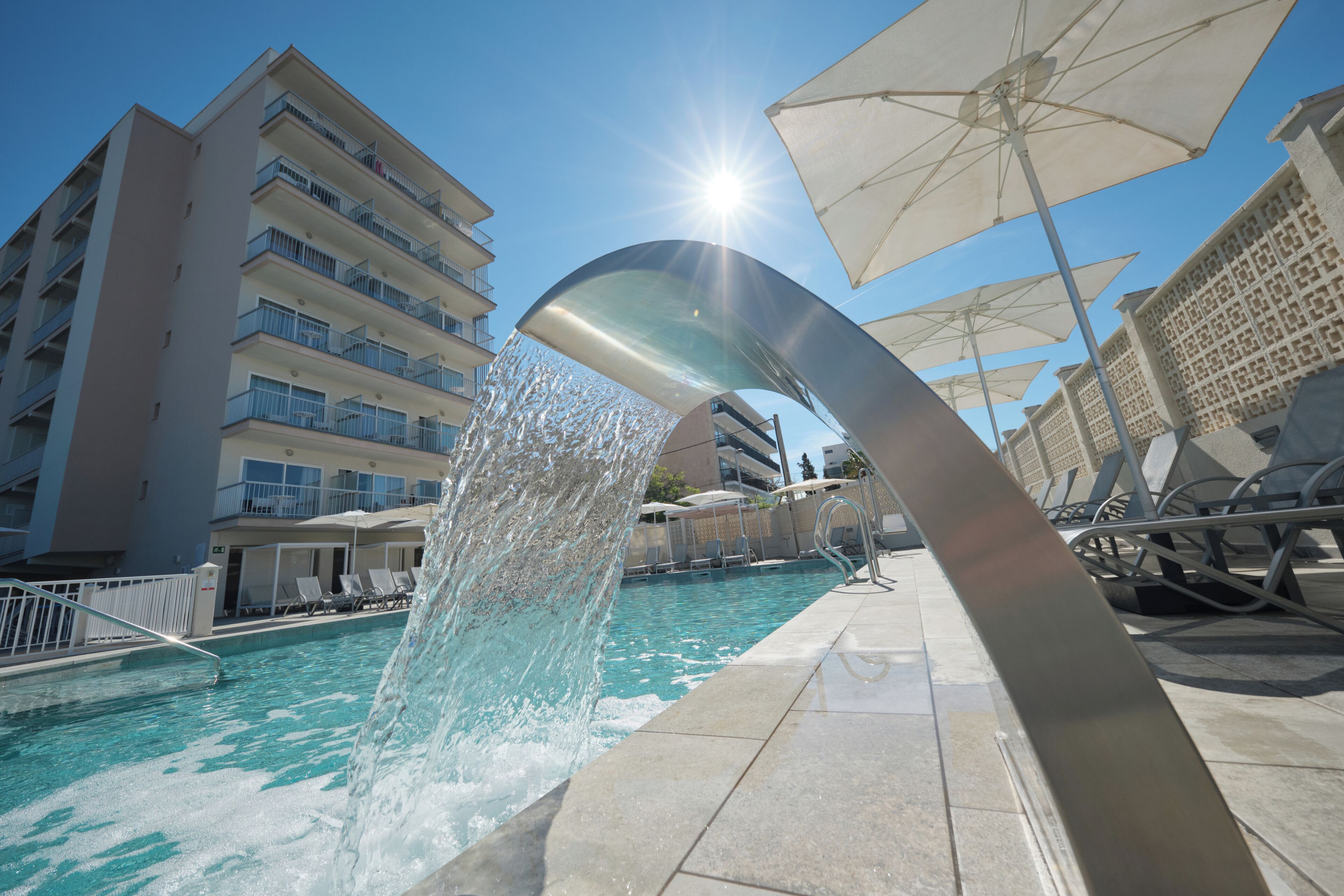 Indoor pool, outdoor pool, pool umbrellas, pool loungers
