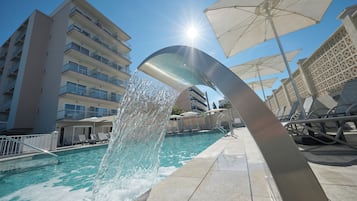 Indoor pool, outdoor pool, pool umbrellas, pool loungers