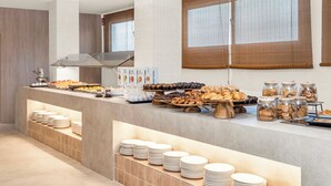 A buffet with various food items, a coffee station, and neatly stacked plates. - Tangerine by Honne Hotels - Adults Only ¨New Opennig¨ (Calvia)