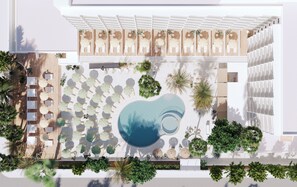 Una piscina al aire libre, sombrillas, tumbonas